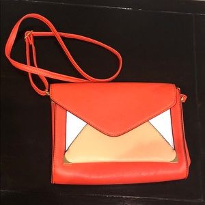 Red-orange, peach and white crossbody bag